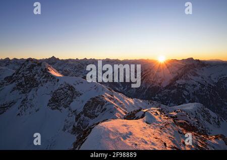 Sunset at the summit of the Gaishorn on a cold winter day. Allgäu Alps, Bavaria, Germany Stock Photo