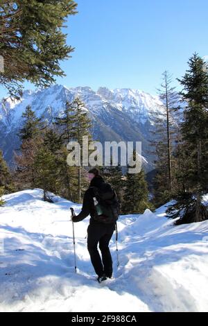 Winter hike 2 women to the Grünkopf near Mittenwald, Europe, Germany, Bavaria, Upper Bavaria, Isar Valley, Karwendel Mountains Stock Photo