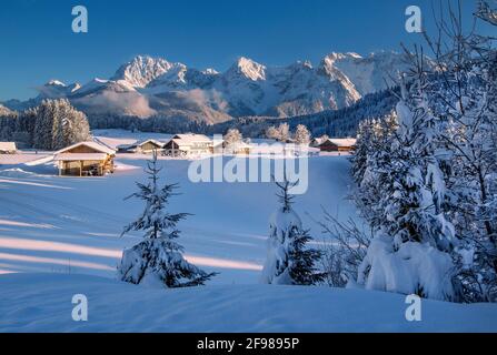 Winter landscape with the hamlet of Gerold against the Karwendel Mountains, Krün, Werdenfelser Land, Upper Bavaria, Bavaria, Germany Stock Photo