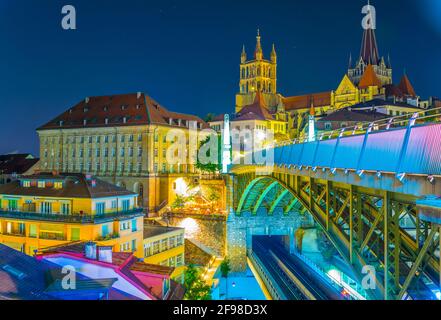 Night view of the Lausanne gothic cathedral Behind Charles Bessieres bridge, Switzerland Stock Photo