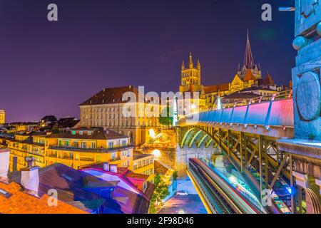 Night view of the Lausanne gothic cathedral Behind Charles Bessieres bridge, Switzerland Stock Photo