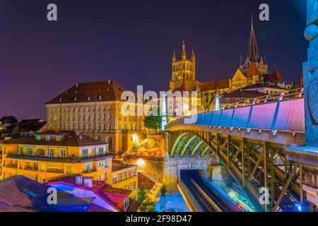 Night view of the Lausanne gothic cathedral Behind Charles Bessieres bridge, Switzerland Stock Photo