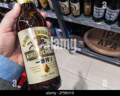 NOVI SAD, SERBIA - APRIL 5, 2021: Kirin Ichiban logo on a light Pilsner beer bottle of their production. Kirin Ichiban is a japanese beer part of the Stock Photo