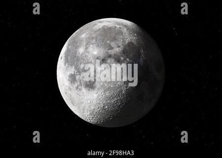 Waning three-quarter moon from October 7th, 2020 with stars in the background Stock Photo