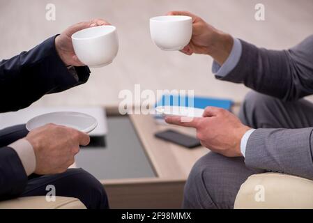 Two businessmen discussing project in the office Stock Photo