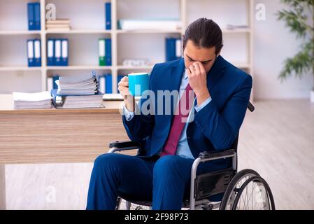 Young male disabled employee working in the office Stock Photo