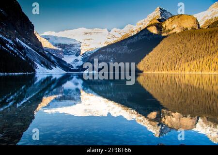 Winter sunrise over scenic Lake Louise in Banff National Park, Alberta Canada Stock Photo