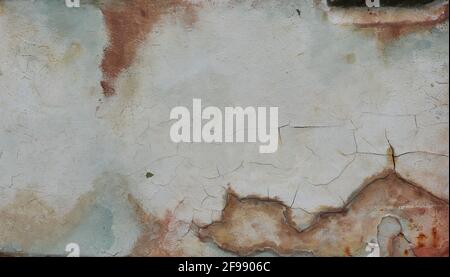 Brown with red with blue and green color rust stain on white and gray metal surface , Abstract background and texture on steel sheet decay Stock Photo