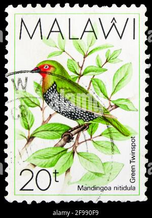 MOSCOW, RUSSIA - NOVEMBER 4, 2019: Postage stamp printed in Malawi shows Green-backed Twinspot (Mandingoa nitidula), Birds serie, circa 1988 Stock Photo