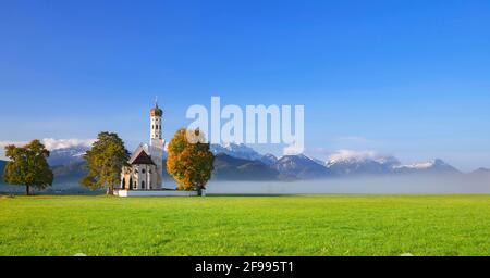 Church of St. Coloman near Schwangau in the morning light in front of the Allgäu Alps. Bavaria, Germany, Europe Stock Photo