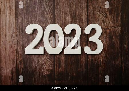 2023 Happy New Year with space copy on wooden background Stock Photo