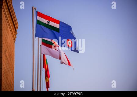 The three flags of the three Armed Forces of India; the Indian Army, Indian Navy and Indian Air Force at India gate (war memorial) located astride the Stock Photo