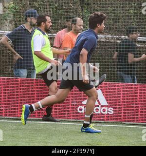 New Delhi, India - July 19 2019: Footballers of local football team during game in regional Derby championship on a bad football pitch. Hot moment of Stock Photo