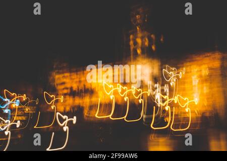 Traces of light at night - light and dark Stock Photo