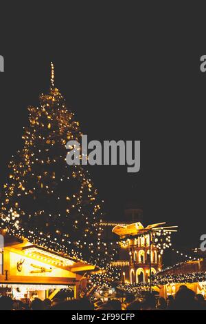 The Augsburger Christkindlesmarkt, Christmas market in Swabia at night. The Christmas tree and the Christmas pyramid, pyramid of lights. Stock Photo