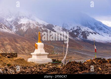 Stupa at Kye Gompa monastery located at an altitude of 4,166 m with snow cladded Himalayas peak and Spiti River Valley in background at Himachal Prade Stock Photo