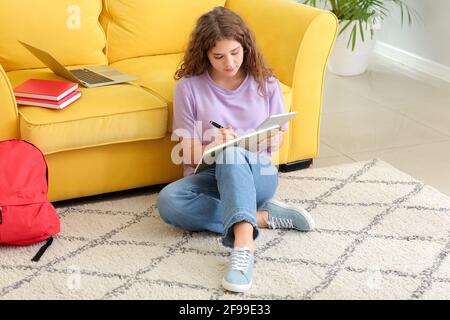 Female student studying online at home Stock Photo