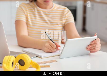 Female student studying online at home Stock Photo