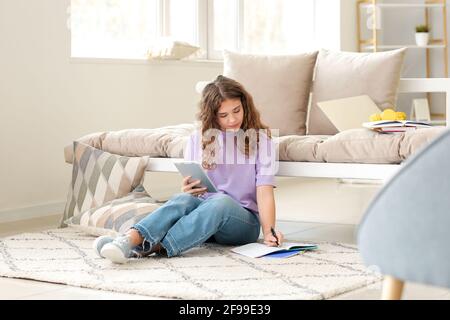 Female student studying online at home Stock Photo