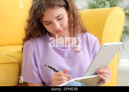 Female student studying online at home Stock Photo