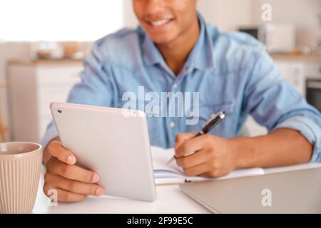 African-American student studying online at home Stock Photo