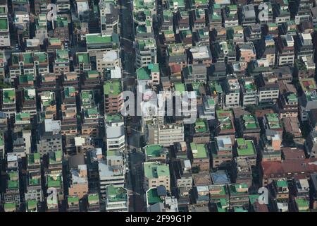 A spectacular aerial view perspective of Seoul from the top of the 123-storey, 555m tall Lotte World Tower skyscraper, South Korea. Stock Photo