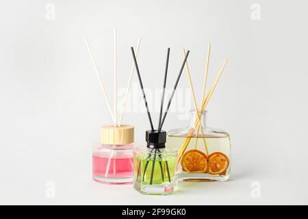 Different reed diffusers on white background Stock Photo