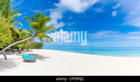 Beautiful tropical island with palm trees and beach swing or hammock panoramic landscape. Luxury travel vacation paradise coast shore sea view inspire Stock Photo