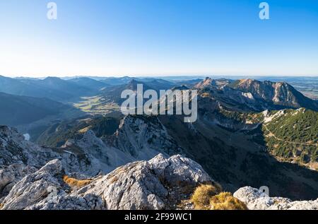Alpine mountain landscape on a sunny autumn day. View from Gimpel to the mountains over the Tannheimer Tal with Aggenstein and Füssener Jöchle. Allgäu Alps, Tyrol, Austria, Europe