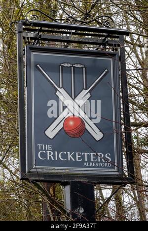 Traditional hanging pub sign at The Cricketers public house, Jacklyns Lane, Alresford, Hampshire, England, UK Stock Photo