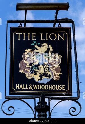 Traditional Hanging pub sign at The Lion Inn - public house - Pagham, Bognor Regis, West Sussex, England, UK a Hall & Woodhouse pub. Stock Photo