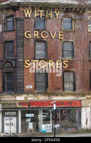 Withy Grove Stores shop front with faded paint and gold sign, Manchester UK Stock Photo