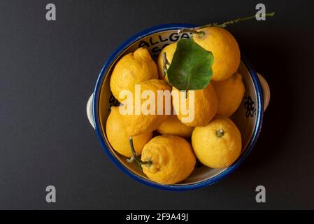 Fresh organic lemons from Sicily in a bowl Stock Photo