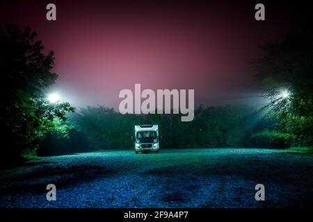 Motorhome on a pitch at night Stock Photo