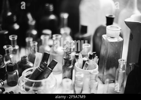 Many Old Deutsch Vintage Medical Glass Capacity. Detail Of Retro Chemical Pharmaceutical Science Researches. Small Bottles Different Sizes From Times Stock Photo