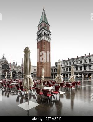 In the mornings, St. Mark's Square in Venice is often empty. There are fewer visitors to the city, especially in the cooler winter months. One or two times a month the famous flood floods St. Mark's Square and ensures beautiful reflections. Stock Photo