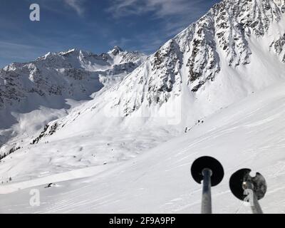 Panoramic view, Kappl ski area, snow-covered mountains, peaks, Verwallgruppe, ski poles, ski slopes, winter, mountains, snow, Kappl, Paznauntal, Tyrol, Austria Stock Photo