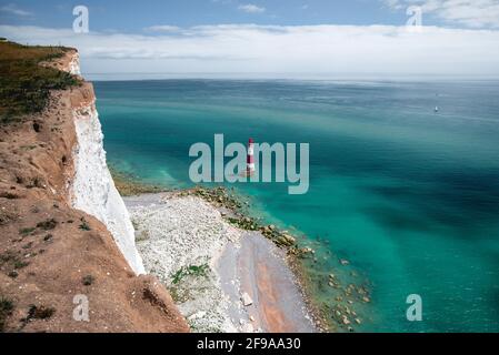 Lighthouse at Beachy Head in the green-blue water in sunshine Stock Photo