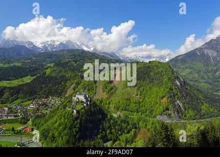 Hohenwerfen Castle with the market town of Werfen and Hochkönig Mountains with clouds in landscape format, Stock Photo