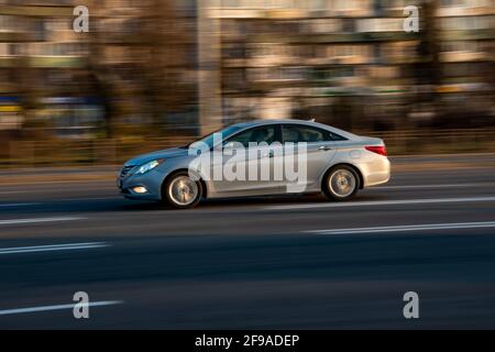 Ukraine, Kyiv - 11 March 2021: Gray Hyundai Sonata car moving on the street; Stock Photo