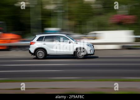 Ukraine, Kyiv - 10 December 2020: White Suzuki Vitaracar moving on the street Stock Photo