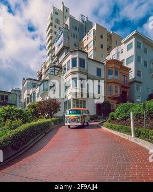 SAN FRANCISCO, CA, USA - April 16, 2018 - Colorful Love Tours van driving along Lombard street. Tourist activity in Bay city. Stock Photo
