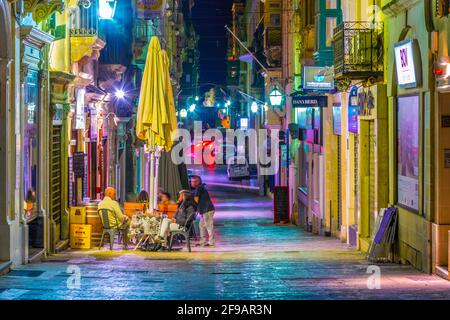 VALLETTA, MALTA, MAY 2, 2017: Night view of a narrow street in Valletta, Malta Stock Photo