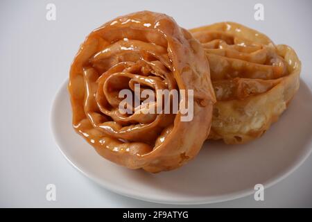 Fresh baked chebakia for ramadan. Chebakia moroccan pastries. Made of strips of dough rolled to resemble a rose, deep-fried until golden, then coated Stock Photo