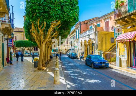 MODICA, ITALY, APRIL 26, 2017: View of a narrow street in Modica, Sicily, Italy Stock Photo