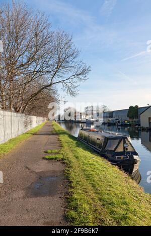 UK, England, London, Southall, Grand Union Canal Towing Path with moored Narrowboat Stock Photo