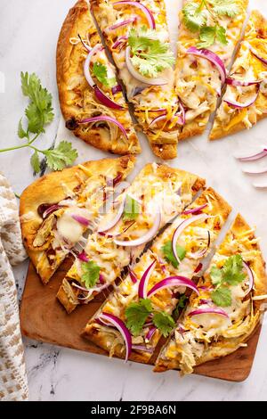 Barbecue chicken flatbreads with hot sauce and red onion Stock Photo