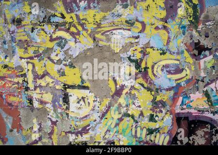 Old wall texture background, peeling cracked paint of different colors seamless pattern and abstract shapes Stock Photo