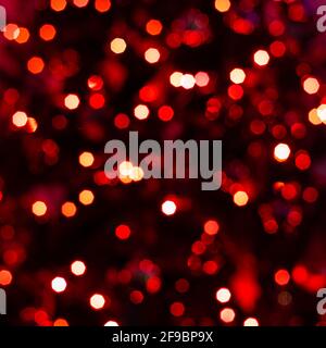 Various blurry red lights on black background. Stock Photo