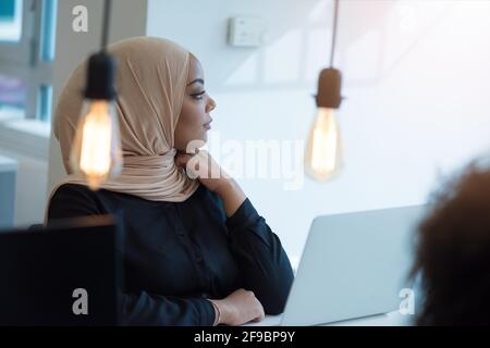 Young muslim African American business woman as a leader at work. Teamwork and multiethnic concept Stock Photo